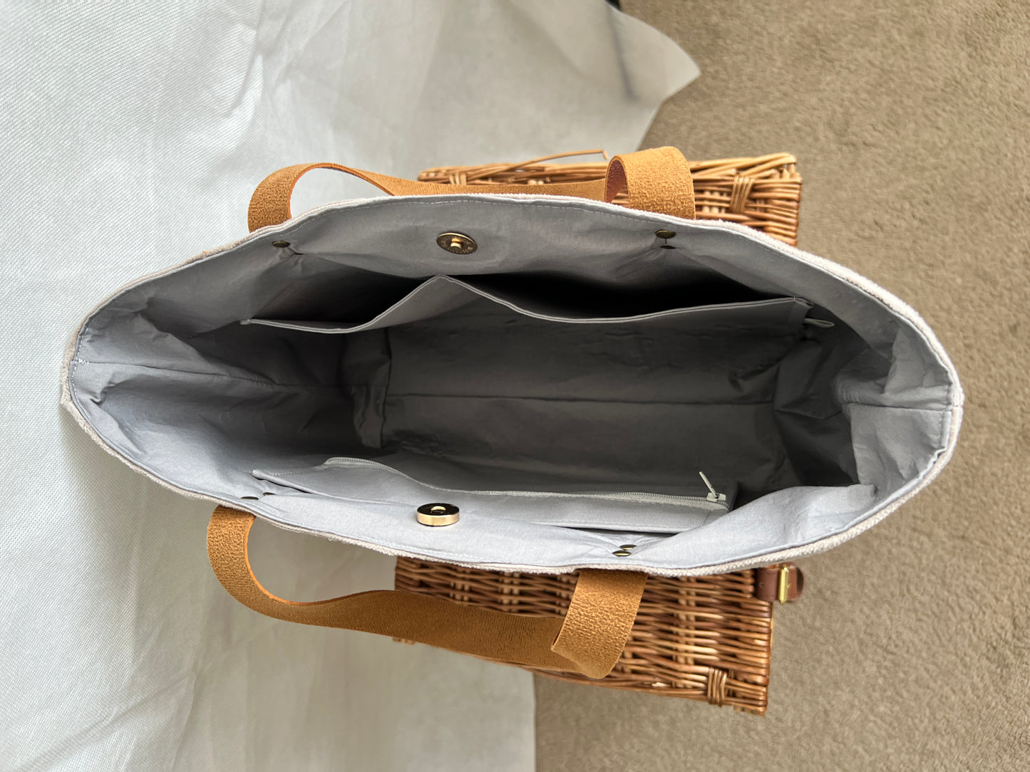 Inside view of upcycled tote bag made from denim, corduroy and cotton fabric scraps with leather handles, 3 inside pockets, on zipped, handmade by Tallulah Riley
