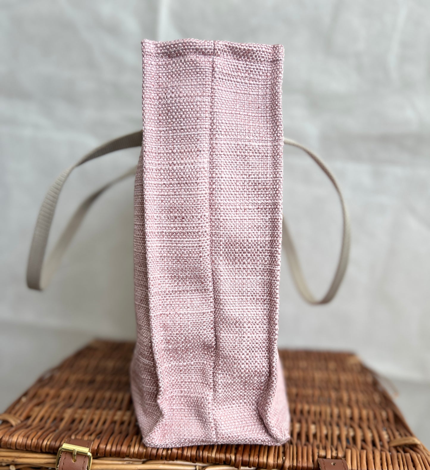 side view of pink tweed style boxy tote bag with beige handles, handmade by Tallulah Riley