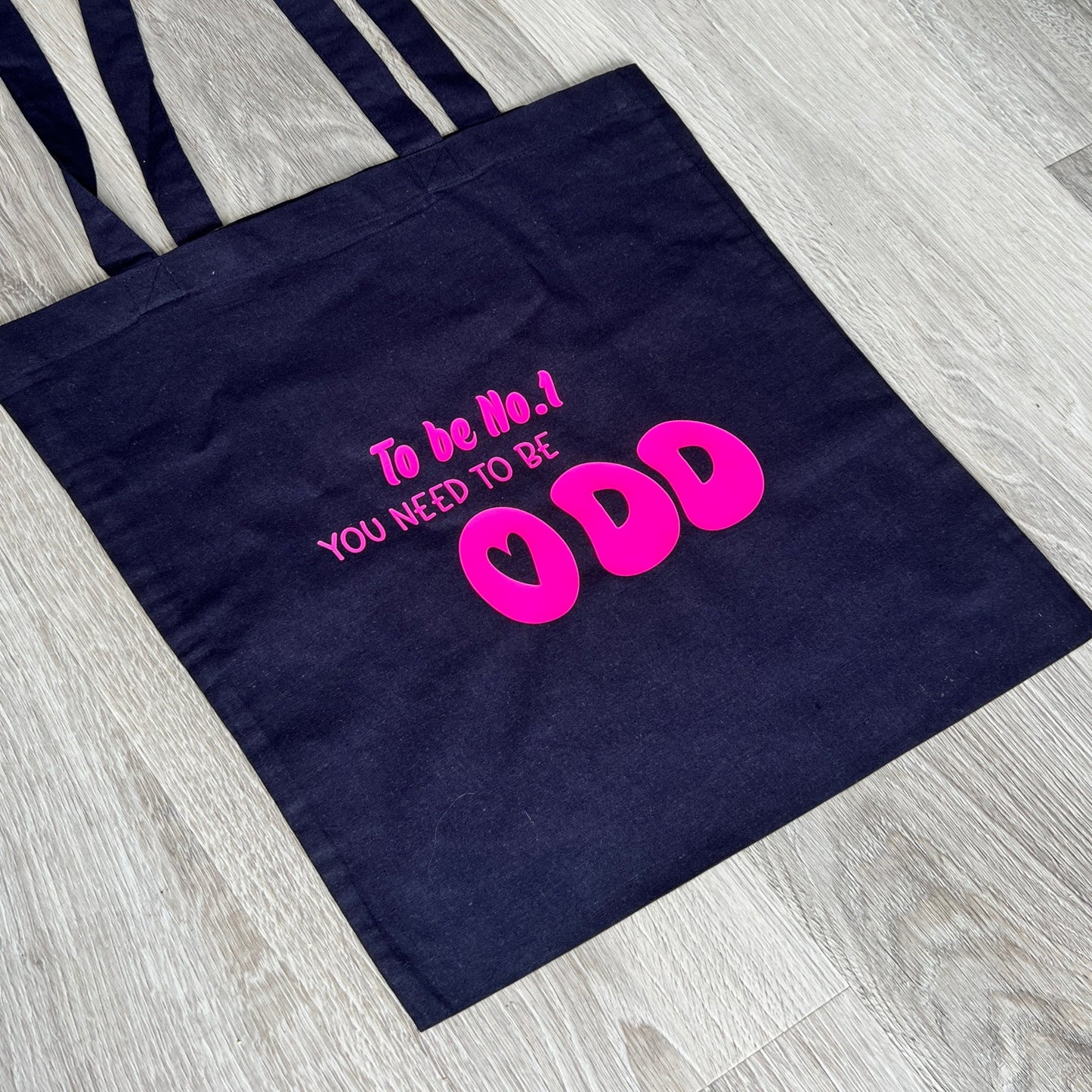 Navy blue tote bag with the text 'To be No.1 you need to be odd', handmade by Tallulah Riley
