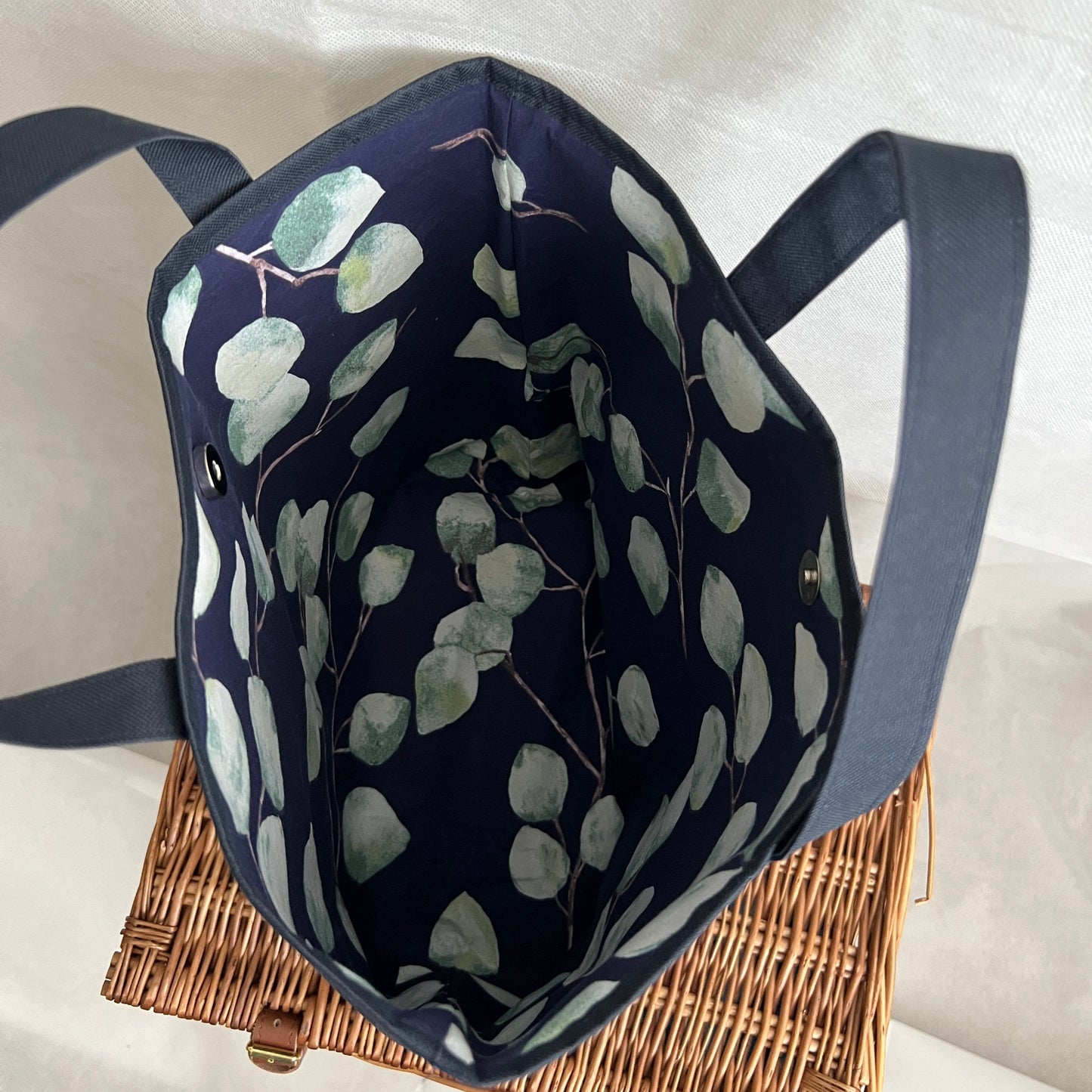 inside view, navy blue, waterproof canvas, strong, tote bag with short handles and outer pocket, contrasting lining with magnetic closure, handmade by Tallulah Riley