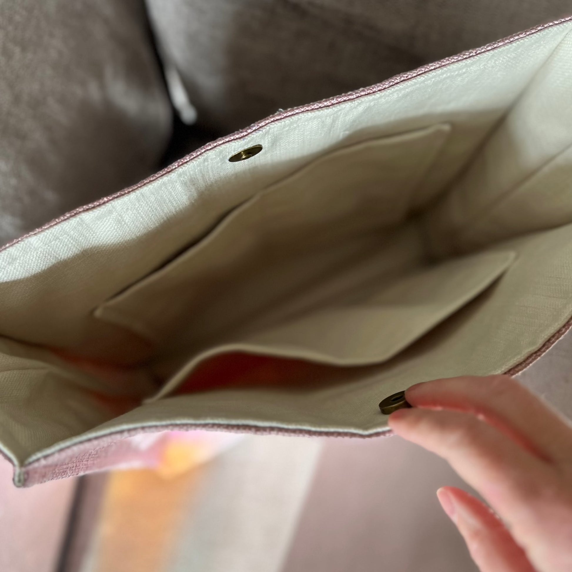 inside view of pink tweed style boxy tote bag with cream lining and three internal pockets, handmade by Tallulah Riley
