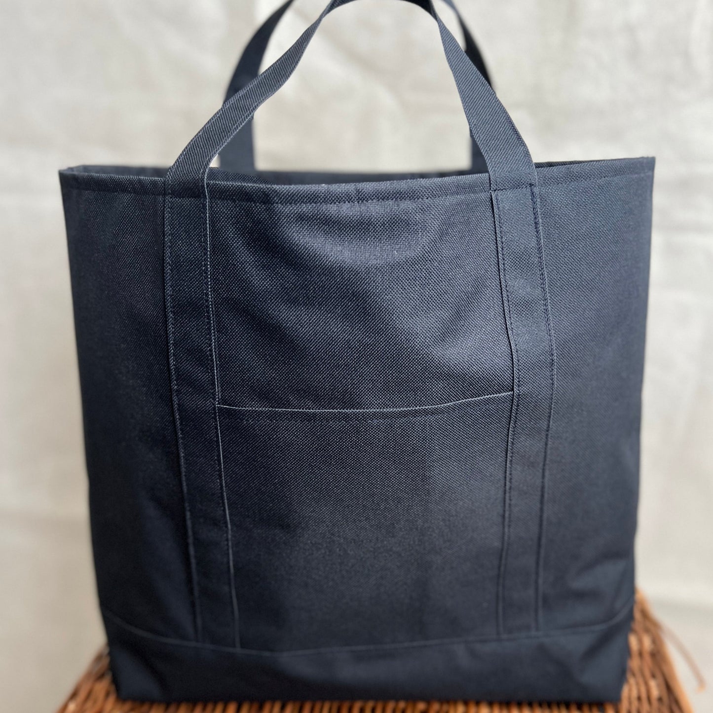 navy blue waterproof canvas strong tote bag with short handles and outer pocket, handmade by Tallulah Riley