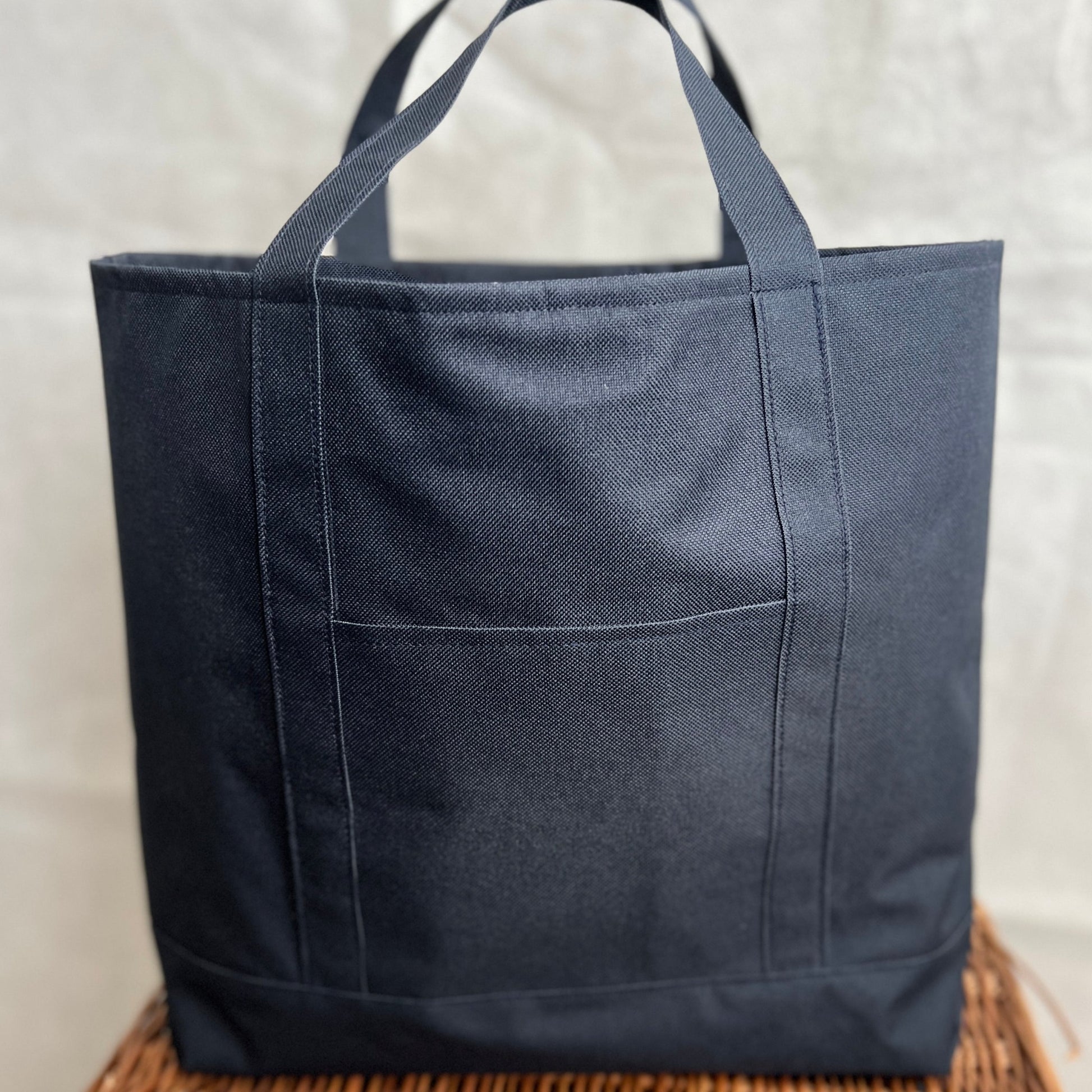 navy blue waterproof canvas strong tote bag with short handles and outer pocket, handmade by Tallulah Riley