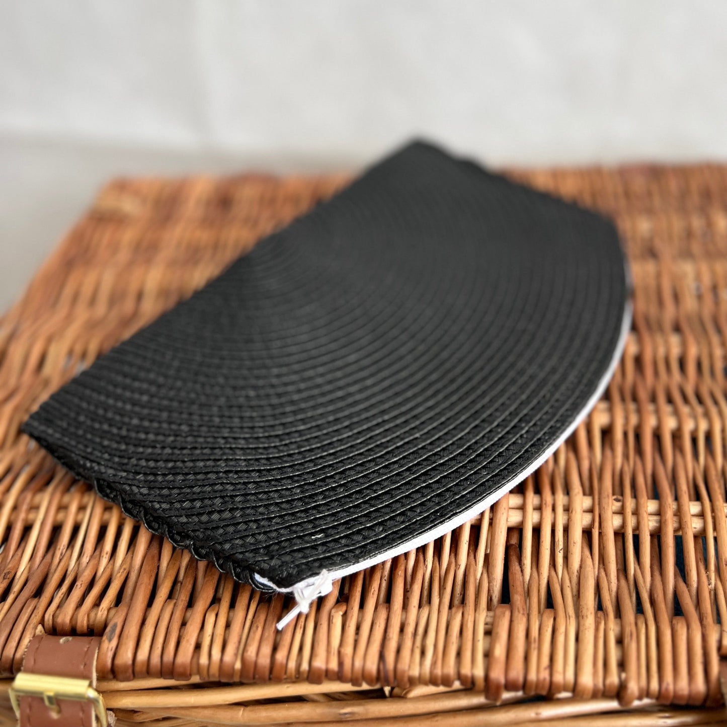 Black woven clutch bag with white zip  handmade by Tallulah Riley